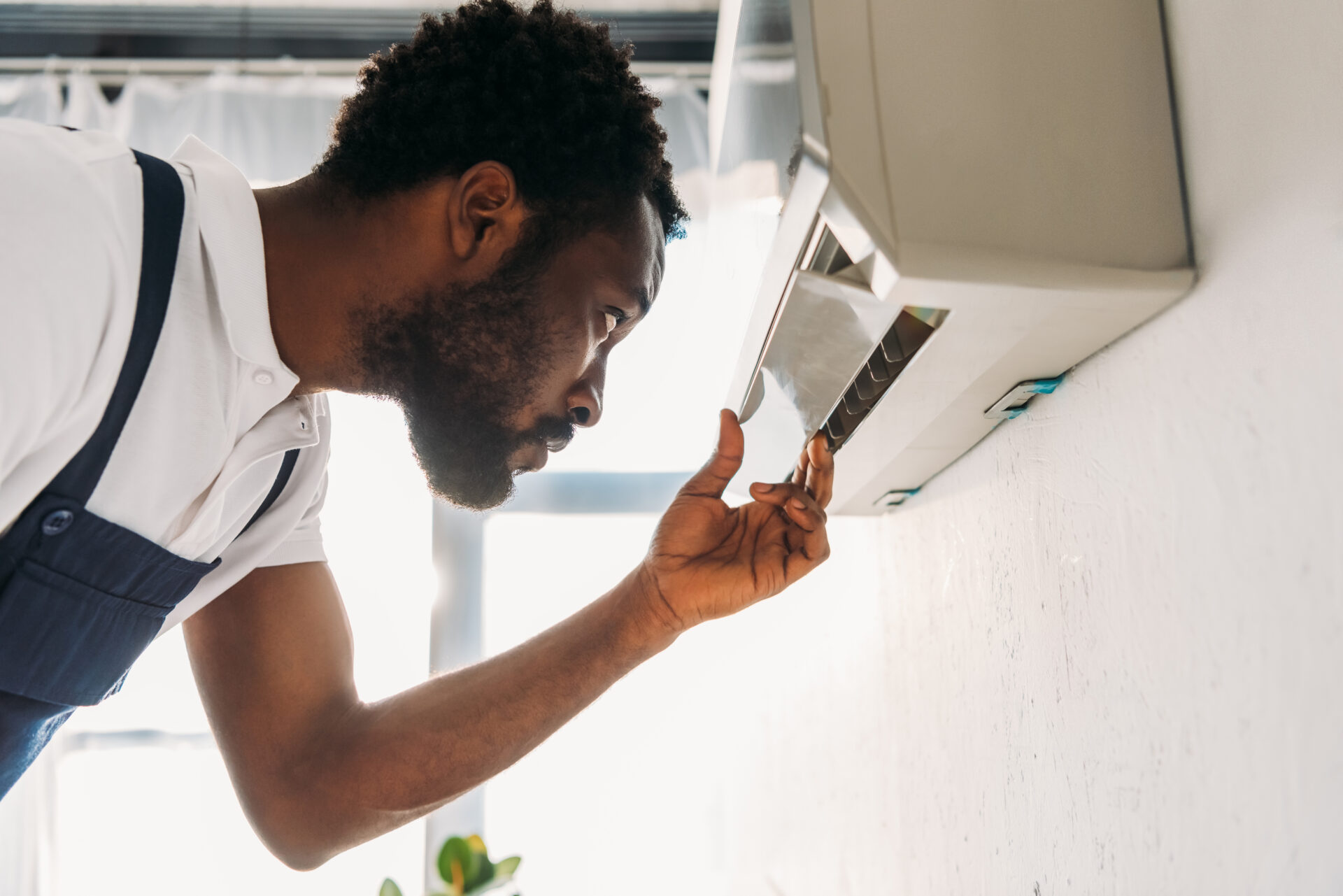 concentrated african american repairman looking at 2021 09 03 01 46 11 utc 1